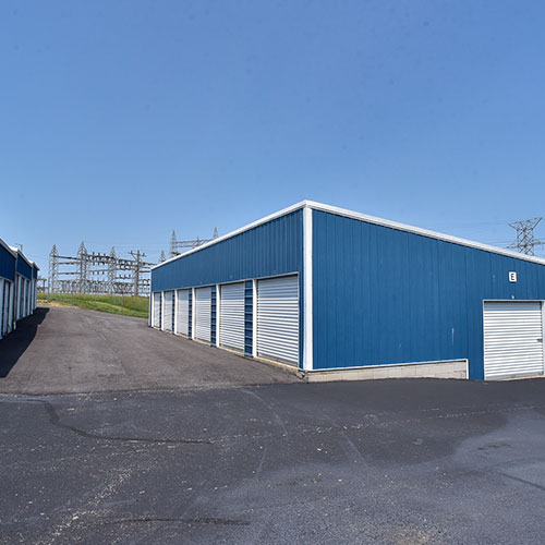 Photograph of outdoor self storage building with oversized doors