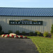 self storage facility sign mounted on the front of a self storage facility front office