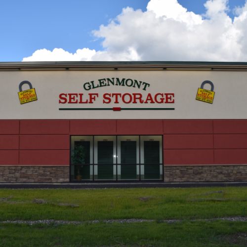 an exterior photo of a self storage office under a bright blue sky