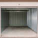 an open self storage building revealing a clean, well-maintained
      interior with metal walls and concrete floor