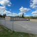 a sign that reads Lubec Safe Storage outside of a fenced in self storage facility