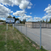 a sign that reads Lubec Safe Storage outside of a fenced in self storage facility