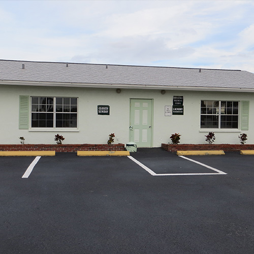 photograph of the coach house park front office and paved parking spaces