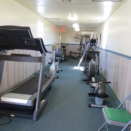 photograph of low impact workout equipment inside a small gym room