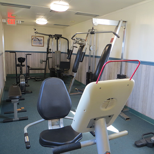 photograph of an indoor gym with low impact workout equipment