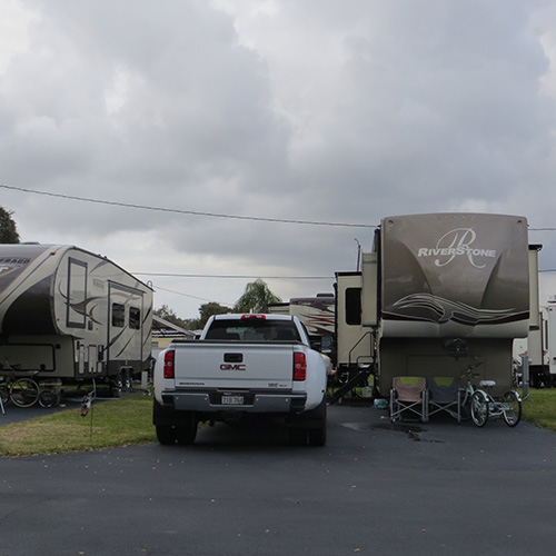  photograph of recreational vehicles parked on green grass
